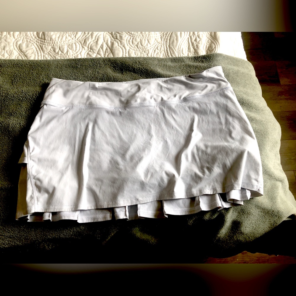 White lululemon tennis skirt. Size 8. Ruffled in the back. Lightly worn.